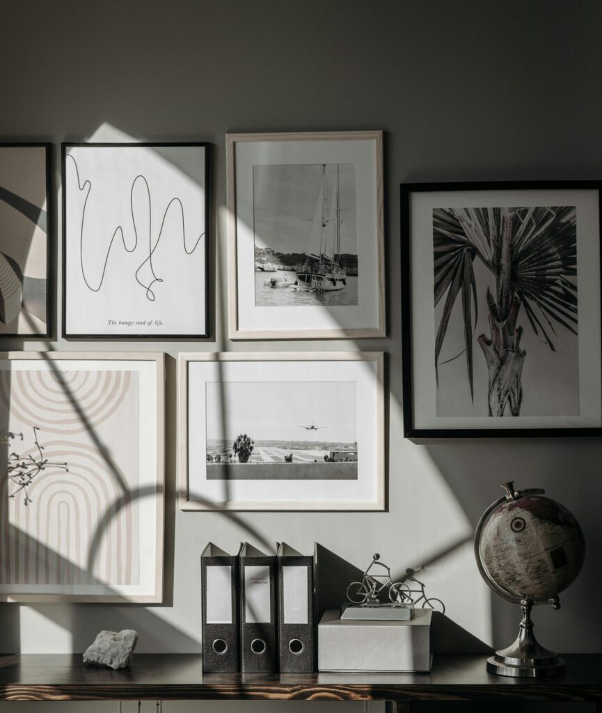 Stylishly arranged wall frames and decor create a contemporary interior space.